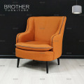 Canapé monoplace orange brillant de style accent de coussin lumineux